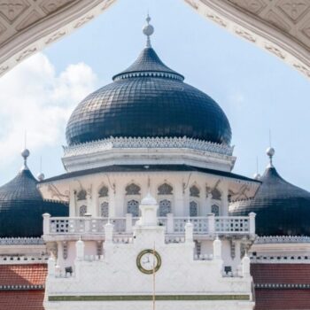 Stunning view of Baiturrahman Grand Mosque in Banda Aceh, showcasing its elegant domes and intricate details.