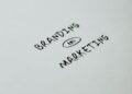 Minimalistic design showcasing 'branding and marketing' text for business strategy visuals.