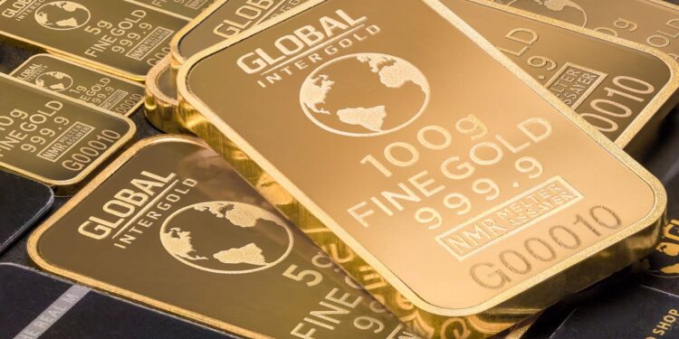 A detailed shot of gold bars labeled 'Global Intergold' as a symbol of wealth and investment.