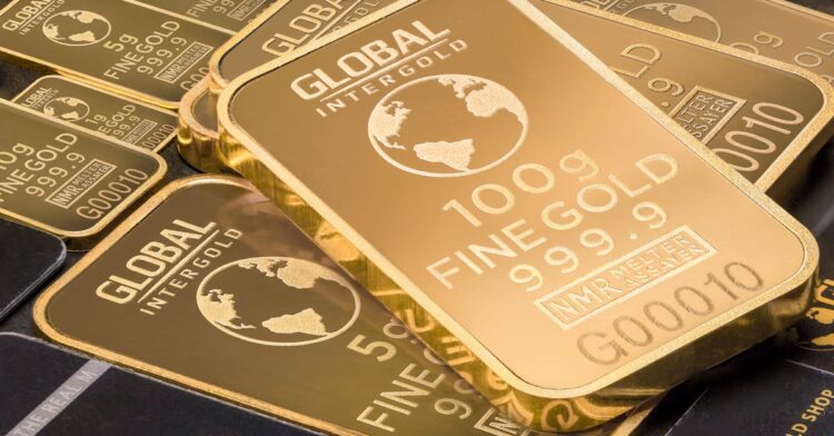 A detailed shot of gold bars labeled 'Global Intergold' as a symbol of wealth and investment.